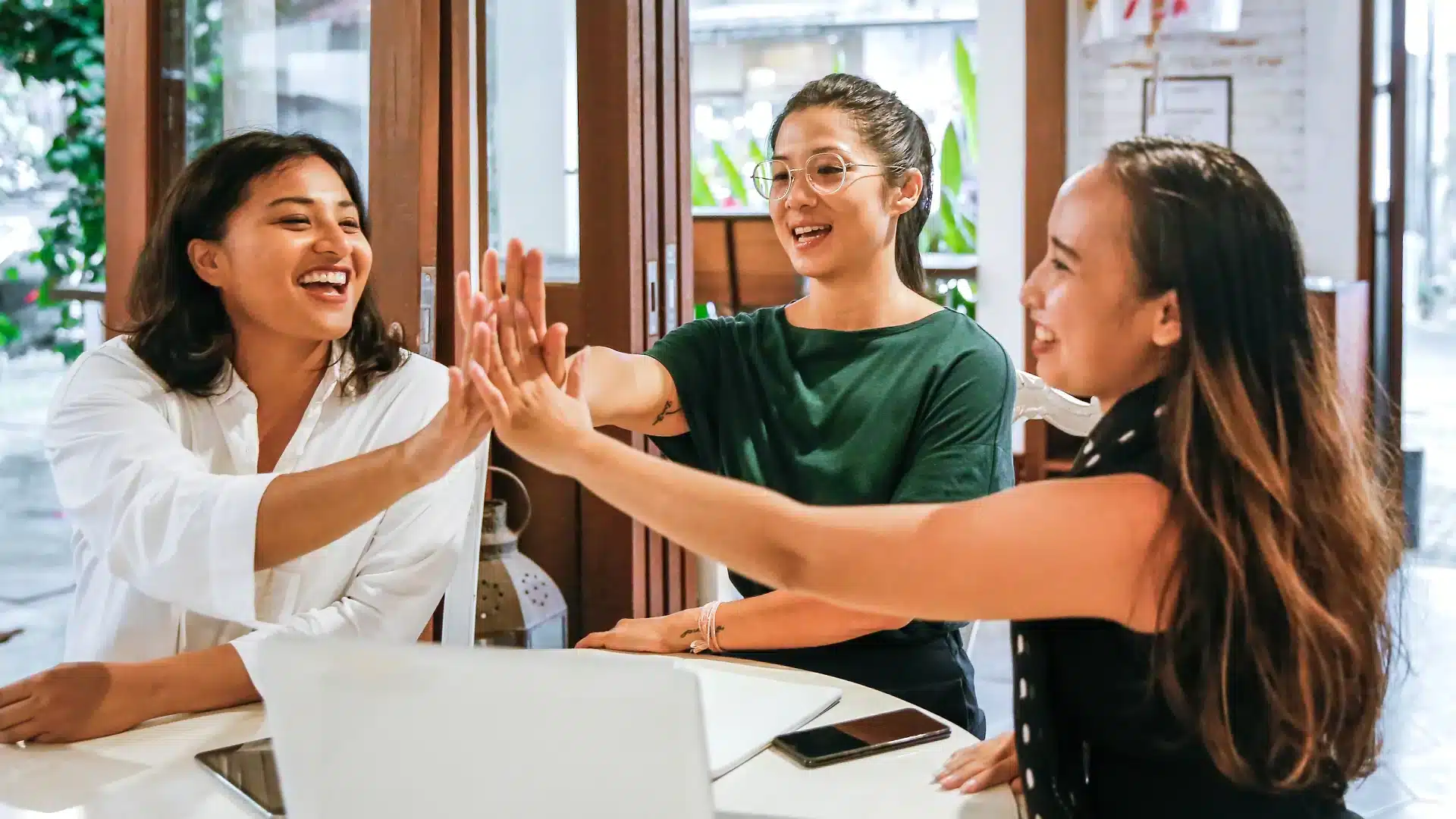 Group of women giving each other high-fives