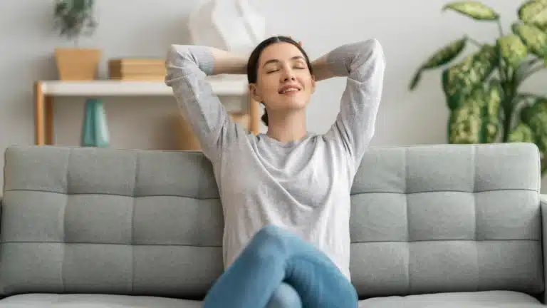 Woman stretching and relaxing on a couch