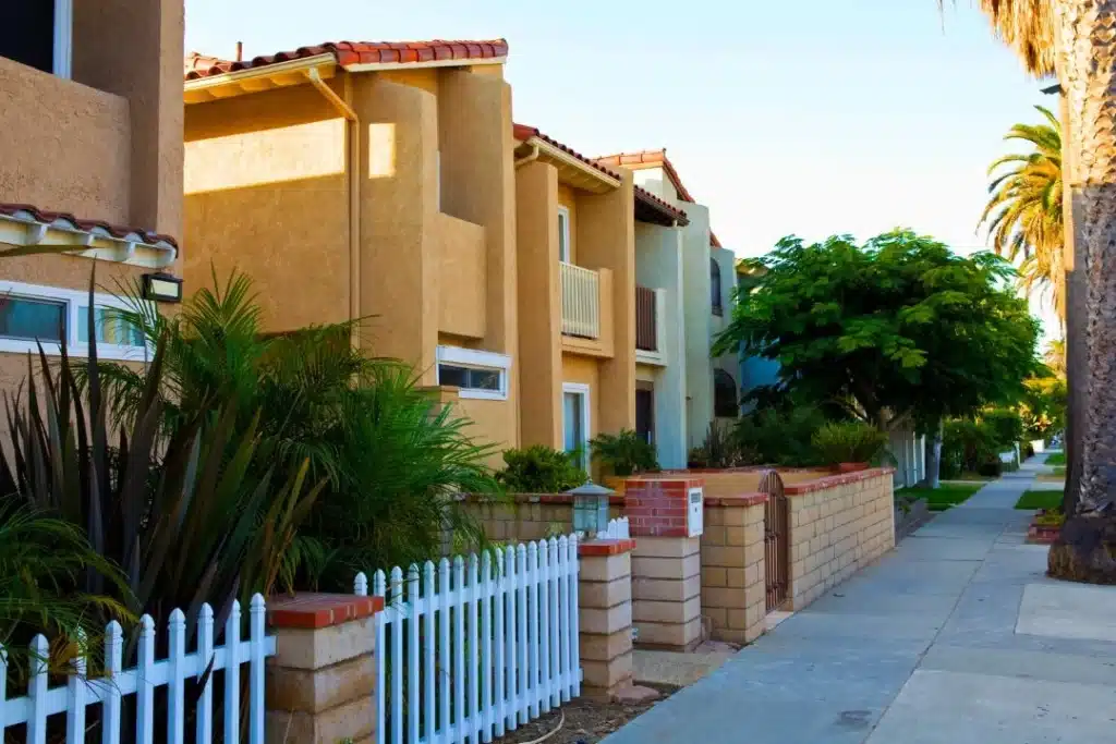 Sunny residential neighborhood in Huntington Beach, California, with palm trees and calm sidewalks—representing local mental health support for women in safe, warm spaces.