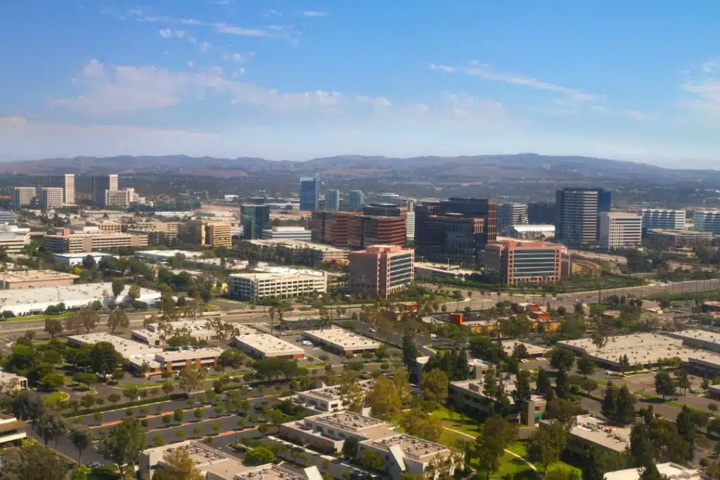 Aerial view of Brea, California showing residential areas, commercial buildings, and greenery in a calm suburban setting